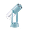 AquaSpin – Humidificador con parte superior redondeada, salida rotativa y base con un botón