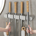 Soporte de pared versátil para herramientas del hogar