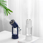AquaSpin – Humidificador con parte superior redondeada, salida rotativa y base con un botón