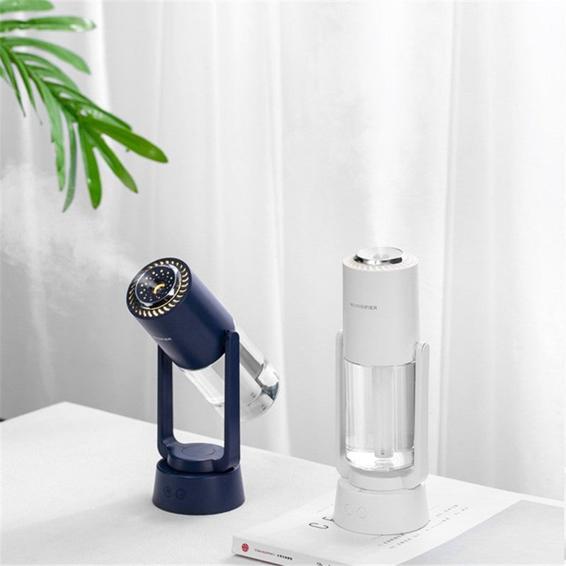 AquaSpin – Humidificador con parte superior redondeada, salida rotativa y base con un botón
