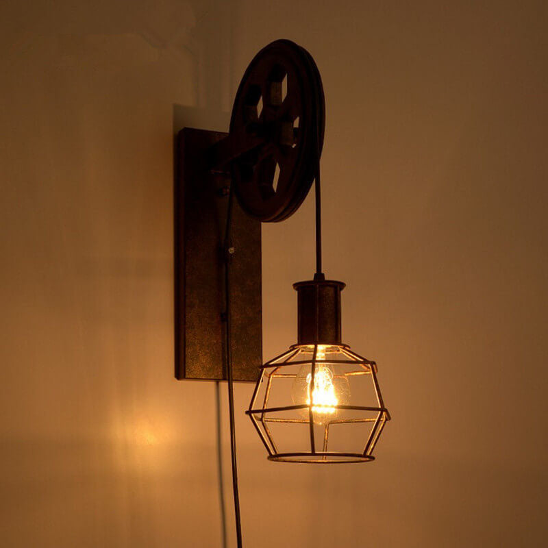 Aplique de pared con polea de hierro y acento de rueda