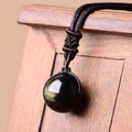 Péndulo "Esfera" en Obsidiana Dorada