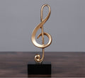 Estatuilla de Nota Musical Dorada – Adorno Decorativo para Mueble o Escritorio