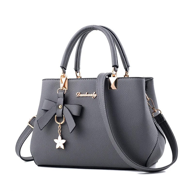 Bolso messenger para mujeres con charm de flores