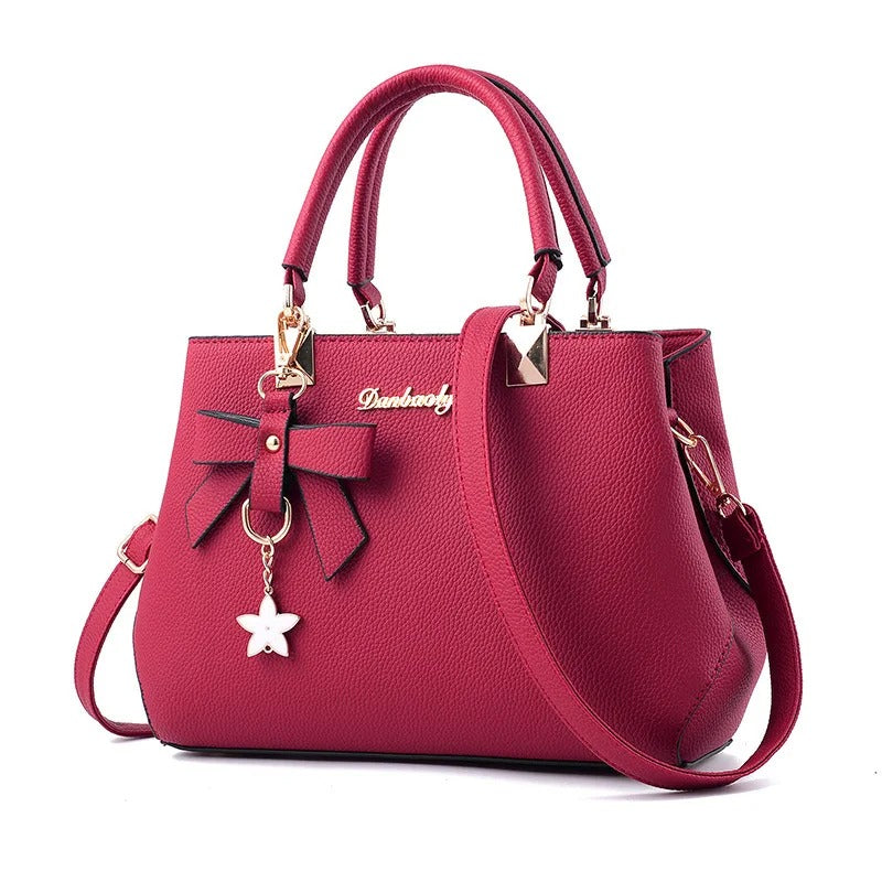Bolso messenger para mujeres con charm de flores